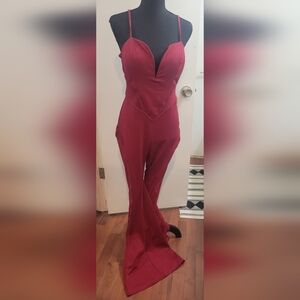 Low cut jumpsuit with sheer cutouts!